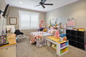 Bedroom with carpet flooring, recessed lighting, ceiling fan, and crown molding