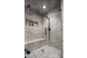 Full bath with a steam shower