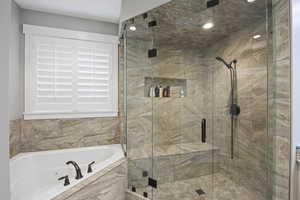 Full bathroom with a oversize jetted tub, a steam shower, and recessed lighting