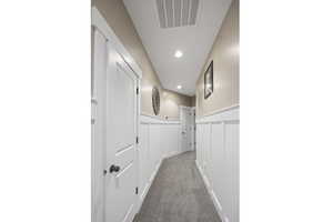 Hallway featuring carpet flooring and recessed lighting