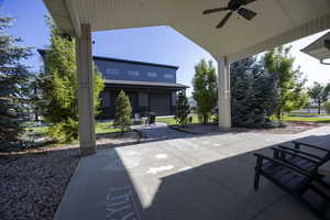 View of patio featuring a ceiling fan