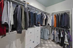 Walk in closet featuring carpet flooring