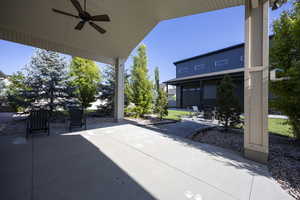 View of patio / terrace featuring ceiling fan and a garage