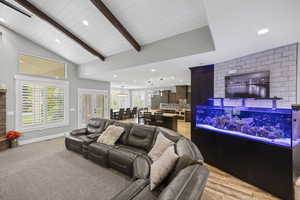 Living area with recessed lighting and baseboards
