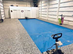 View of pool with a swimming pool. epoxy flooring and closed cell foam insulation with waterproof paint.