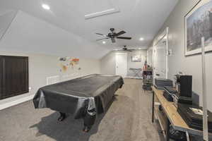 Game room featuring light carpet, billiards table, ceiling fan, baseboards, and vaulted ceiling