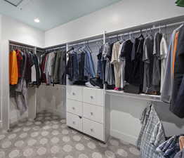 Spacious closet with carpet floors