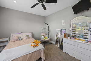 Bedroom featuring carpet flooring, a ceiling fan, baseboards, and recessed lighting