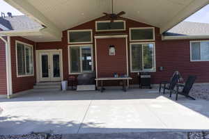 View of patio / terrace featuring french doors, area for grilling, ceiling fan, and entry steps