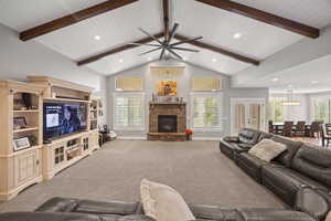 Living room featuring a fireplace, recessed lighting, ceiling fan, baseboards, and carpet flooring