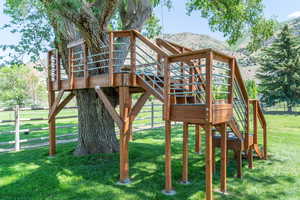View of play area with stairs and a mountain view