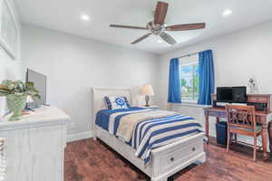 Bedroom featuring dark wood-style flooring, recessed lighting, baseboards, and ceiling fan
