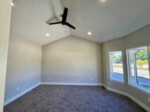 Master bedroom with vaulted ceiling and ceiling fan