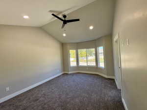 Master bedroom with vaulted ceiling and ceiling fan