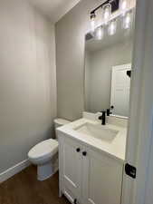 Half bathroom featuring vanity