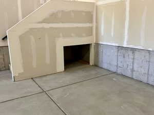Storage area beneath garage stairs
