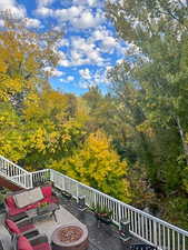 Wooden deck featuring an outdoor fire pit