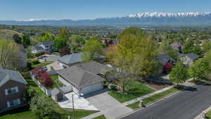 Aerial view of residential area featuring a mountainous background