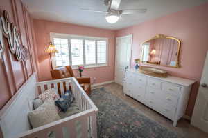 Main floor bedroom 1 with beautiful custom wall details.