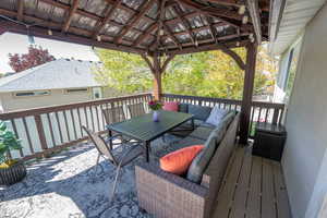 Trex deck featuring an inviting outdoor living space, outdoor dining area, and a gazebo (Gazebo included in sale!)
