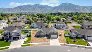 Aerial perspective of suburban area featuring a mountainous background