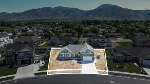 Aerial perspective of suburban area with mountains and property boundaries highlighted