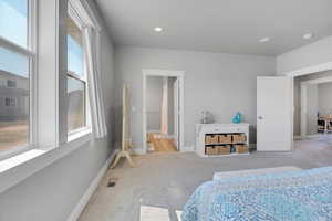 Bedroom featuring carpet, baseboards, and recessed lighting