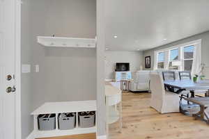 Dining room featuring light wood-style flooring and recessed lighting