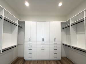 Walk in closet featuring wood finished floors