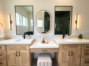 Bathroom featuring two vanities
