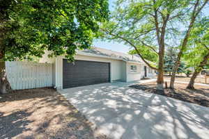 Ranch-style home with an attached garage and driveway