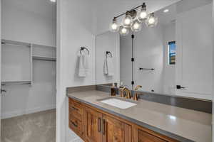 Bathroom with vanity and baseboards