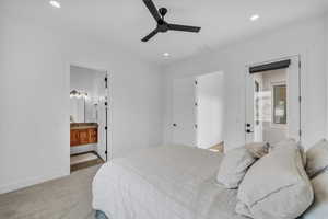 Carpeted bedroom with recessed lighting, connected bathroom, baseboards, and a ceiling fan