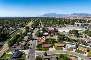 Aerial perspective of suburban area featuring a mountain backdrop