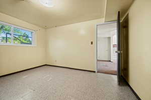 Unfurnished room featuring baseboards