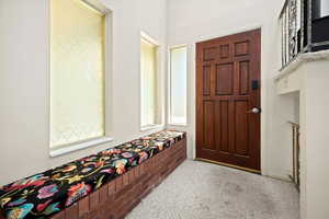 View of carpeted foyer entrance