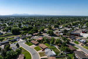 Aerial view of residential area featuring a mountain backdrop