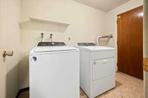 Laundry area featuring separate washer and dryer