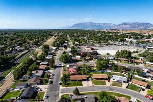 Aerial perspective of suburban area featuring a mountain backdrop