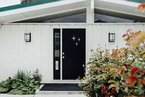Entrance to property with board and batten siding