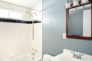 Full bath with toilet, shower / bath combination, and vanity