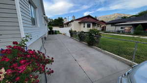 View of patio / terrace with a mountain view and concrete driveway