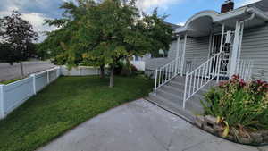 Entrance to property with a chimney