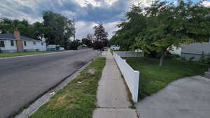 View of asphalt street with sidewalks