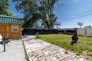 Fenced backyard with a patio area