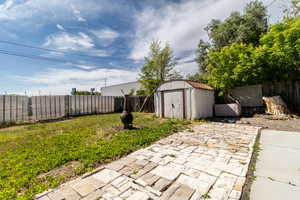 Fenced backyard featuring a patio
