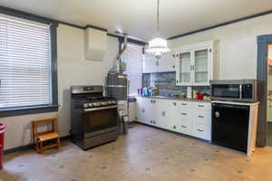 Open kitchen, gas stove and dishwasher
