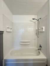 Full bath featuring bathing tub / shower combination