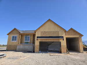 Property under construction with an attached garage