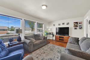 Living room featuring wood finished floors and baseboards